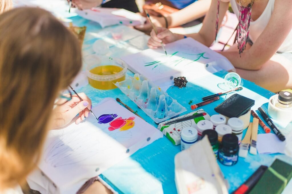 Back to school. Selective focus. Children paint with paints. Learn to draw.